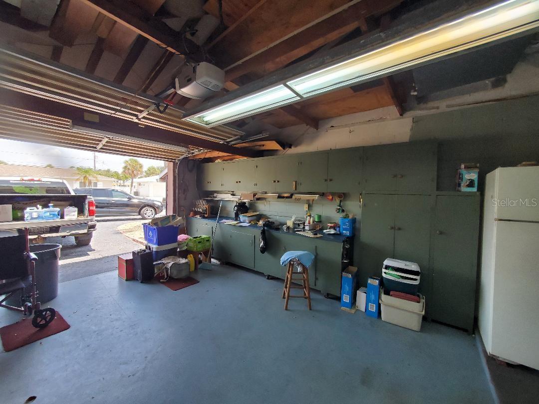 Over-sized Garage, work bench with built-in cabinets.