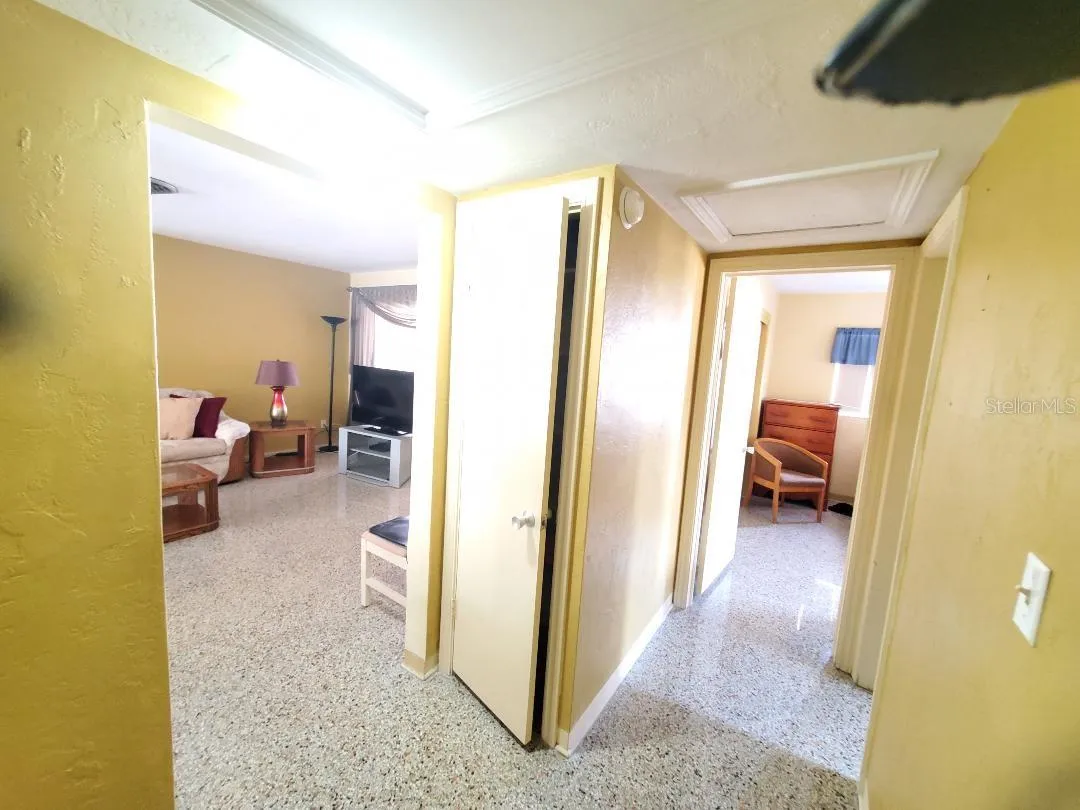 Hall between living room, guest bathroom and 2 bedrooms.
