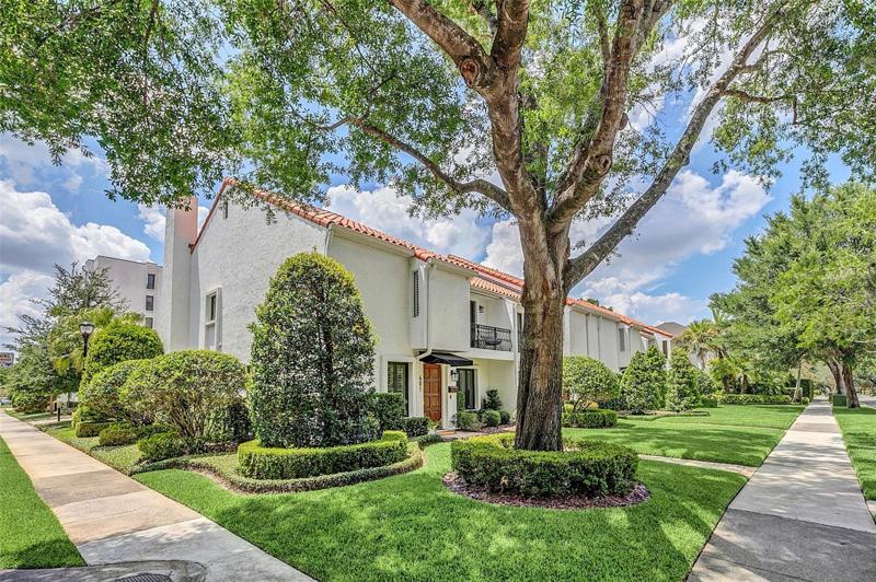 End unit on a corner lot - this townhome lives like a SFH.