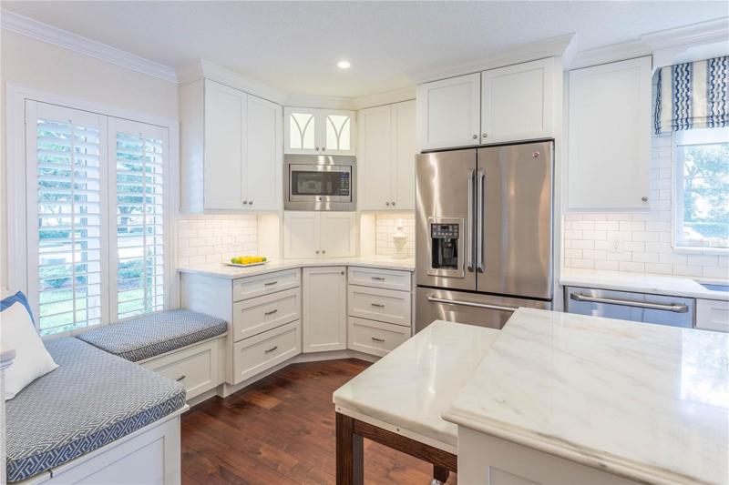 Dinette window seat with retractable table - *shows previous refrigerator which has been replaced.