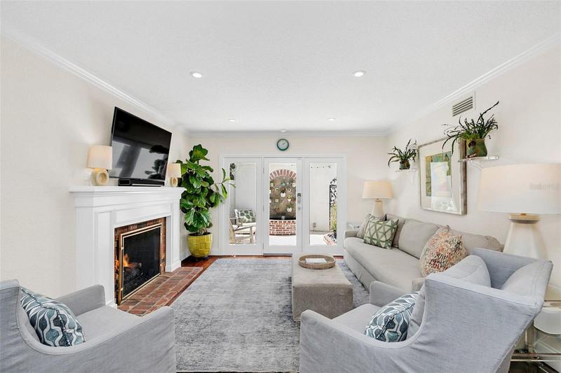 Kitchen opens to the family room with a gas fireplace and patio views.