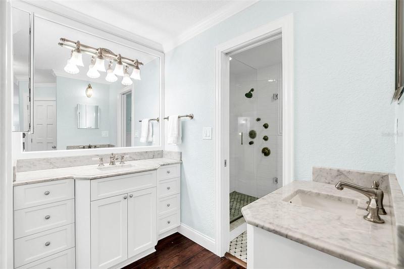 Main bathroom with double vanities.