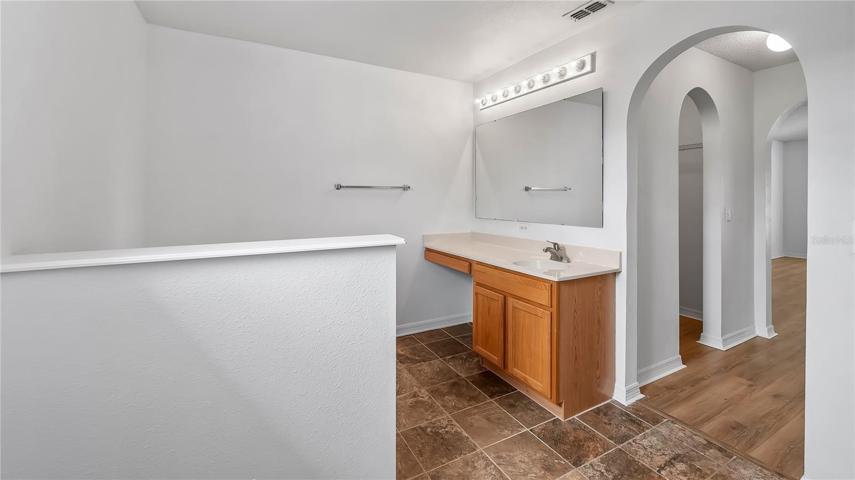 Master bathroom with extended sink/vanity area