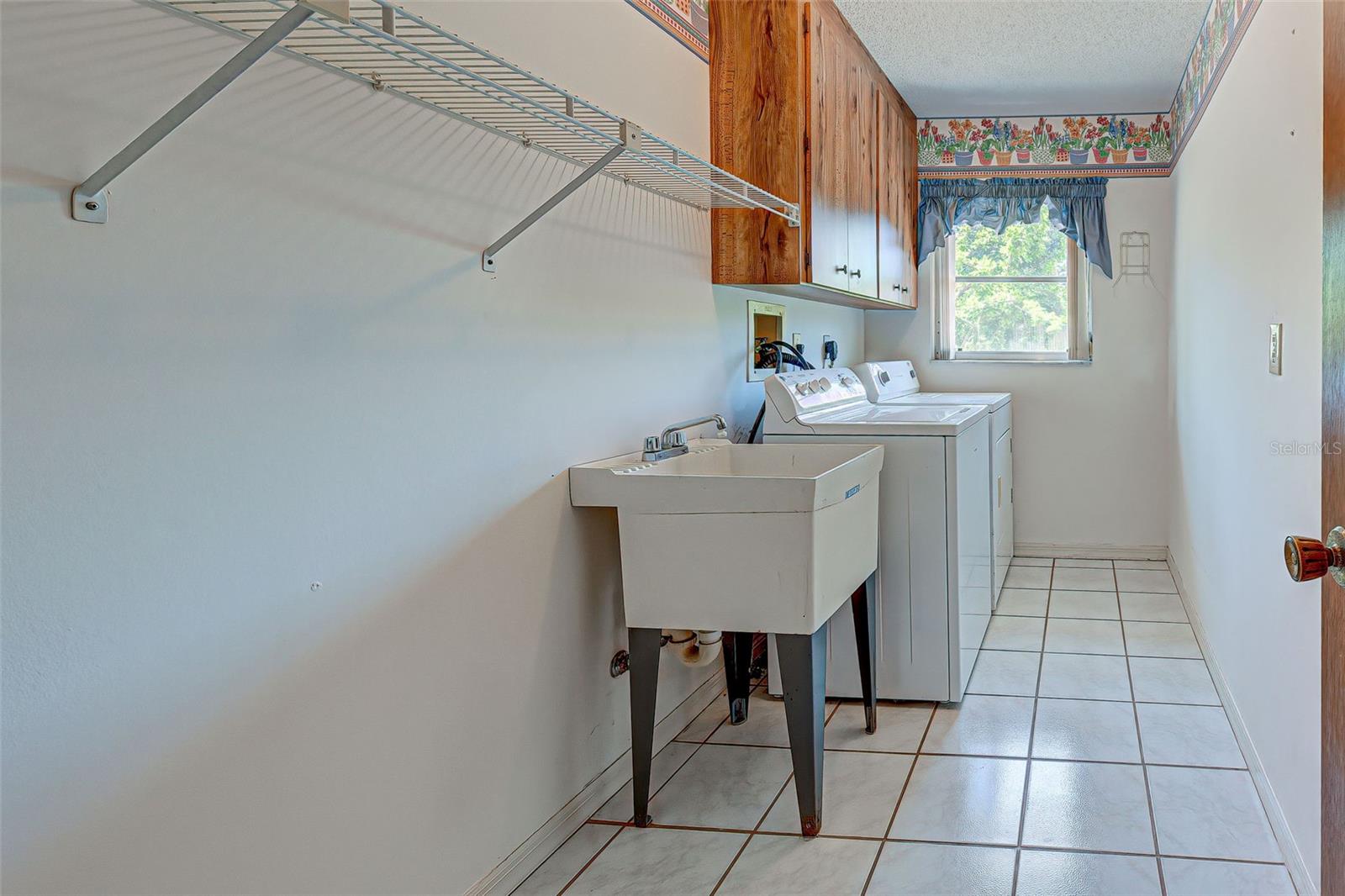 Spacious Laundry Room With Utility Sink.