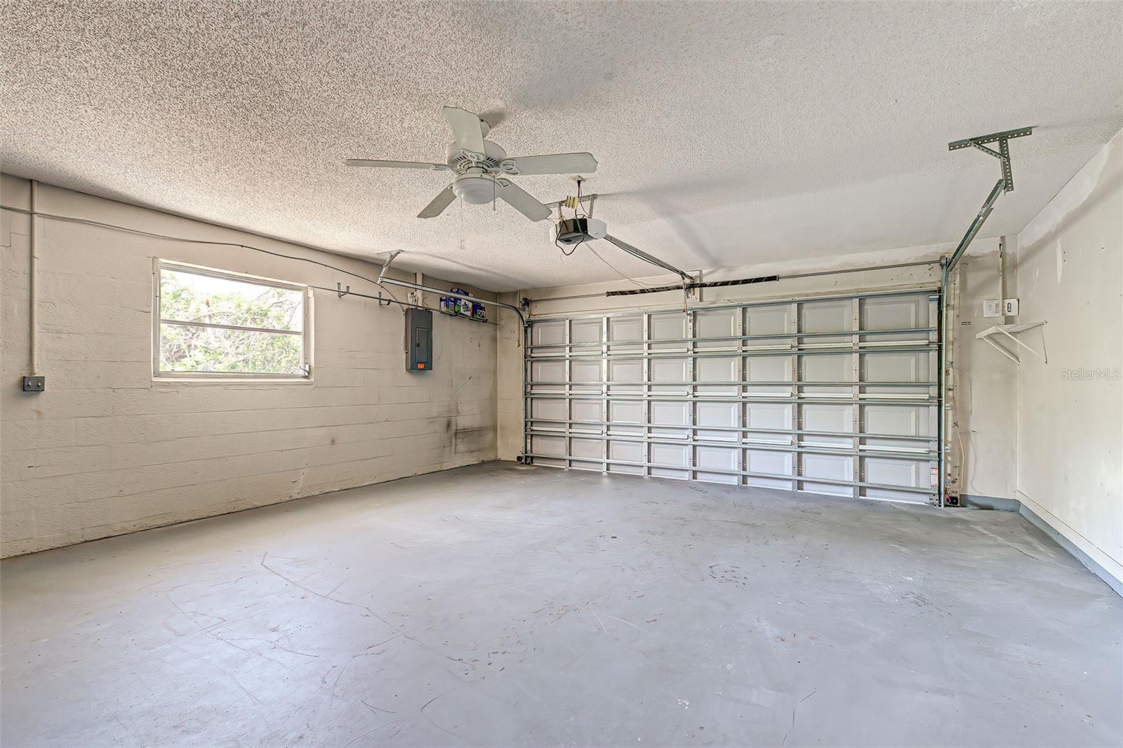 Large 2 car garage - Wind Rated Overhead Door with Electric Opener.
