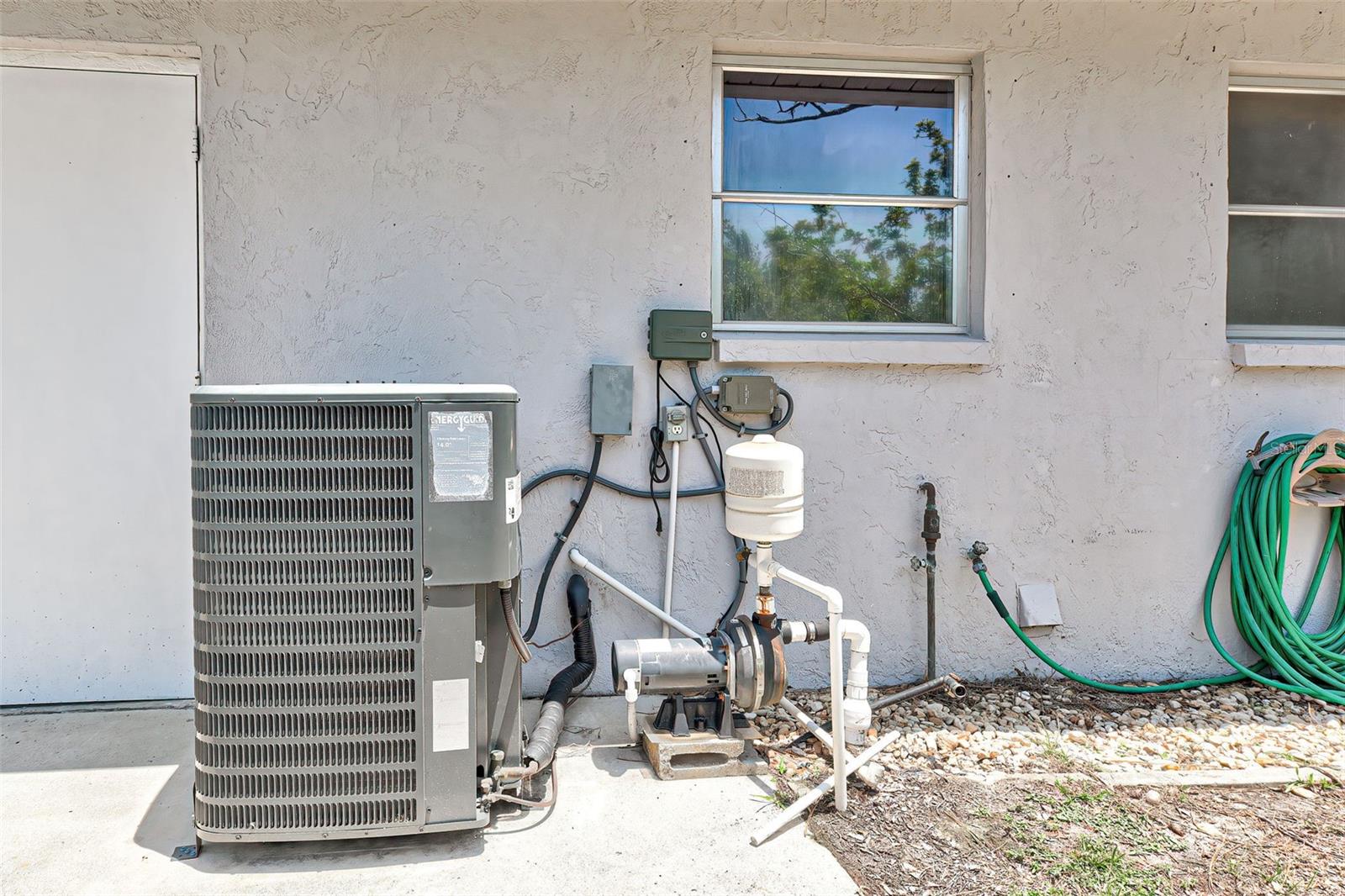 AC Condenser Unit and Well Pump Equipment for Irrigation.
