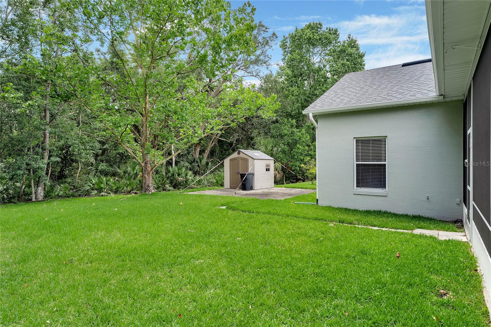 Settle into a comfortable chair within the spacious lanai and relish the beauty of the outdoors while enjoying the tranquility and protection of the screened-in patio.