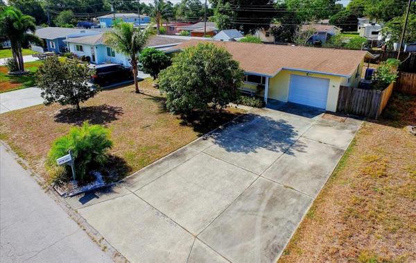 This oversized driveway has room for 4 cars!