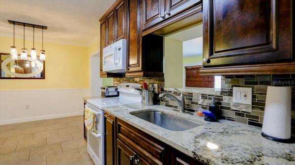 Beautiful granite countertops in this updated kitchen.