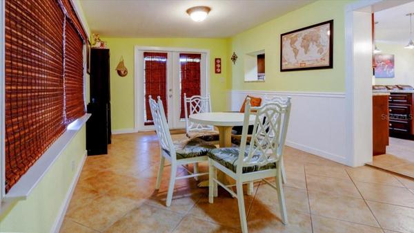 French doors open to a covered back patio.