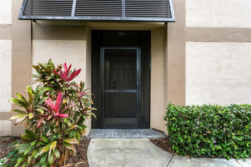 Private entrance with new screen door, grandfathered in by HOA