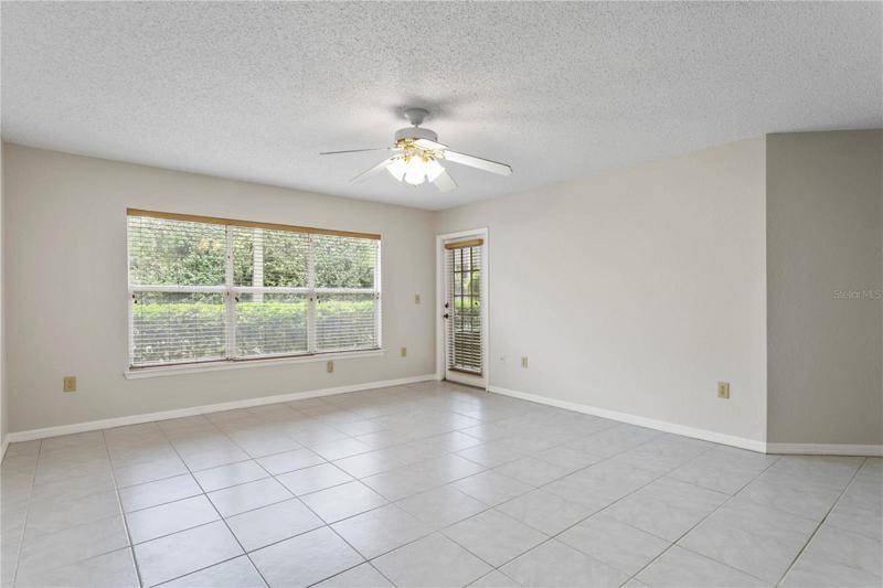 Living Room with access to Private Back Patio