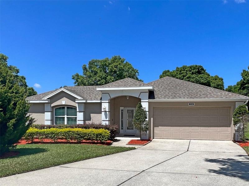Front Exterior with storm door, Gutters, newer roof, located in a culde sac