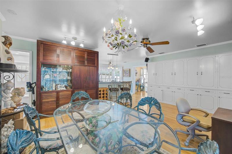 Family room has a full wall of extra cabinets.