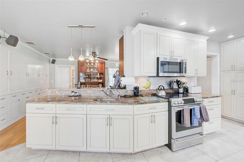 Breakfast bar over looks Family Room/Dining room.