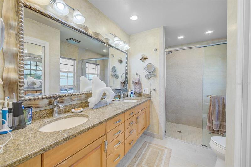 Master Bath with large walk in shower and his and her sinks