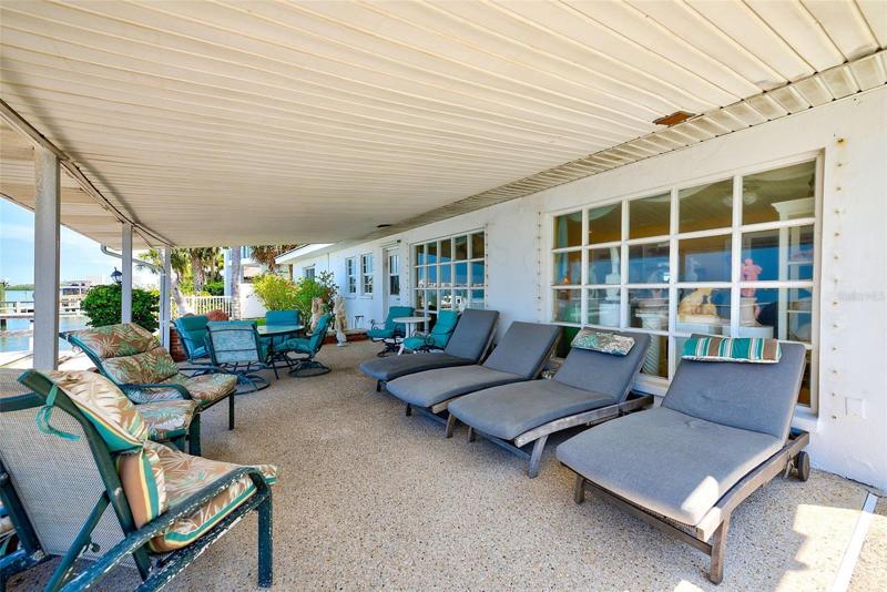 Enjoy the covered lanai overlooking the water.