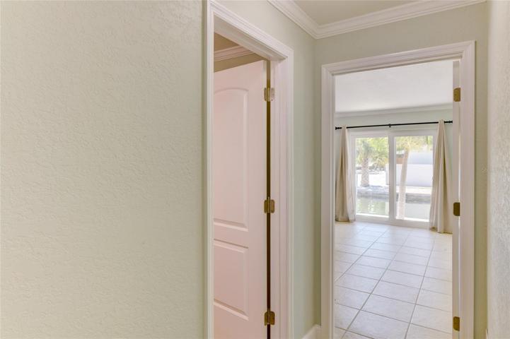 The guest bedroom on the left and the entrance to the main bedroom