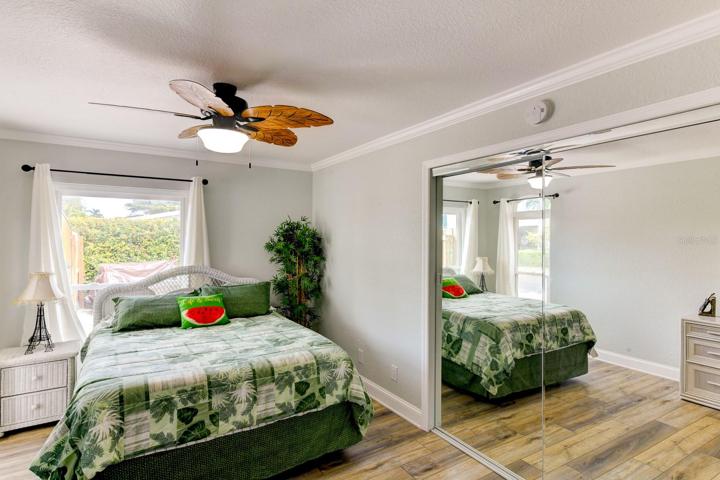 Guest bedroom with a ceiling fan