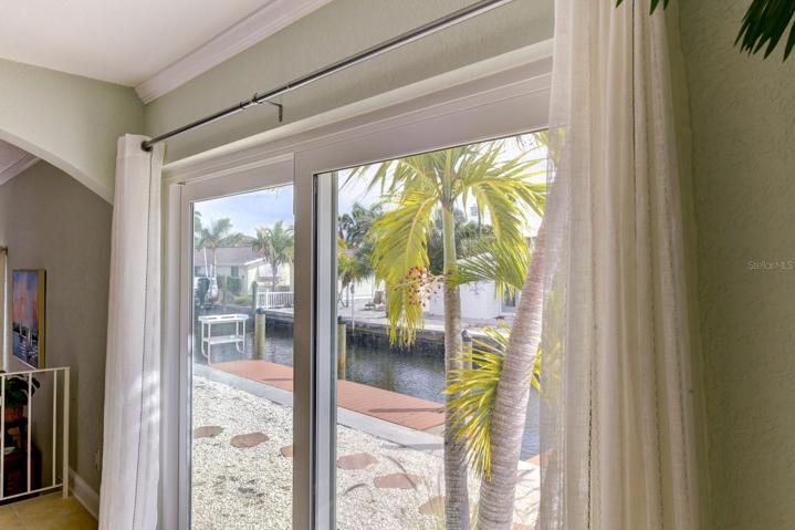 The glassed sliders leading to the low maintenance backyard