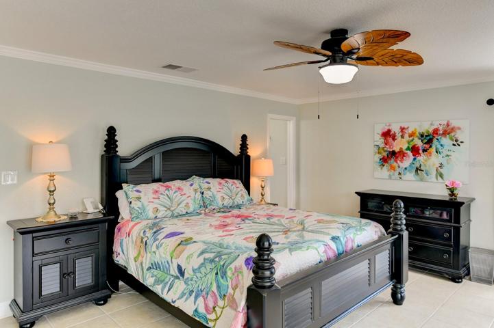 Large format tile flooring in the main bedroom