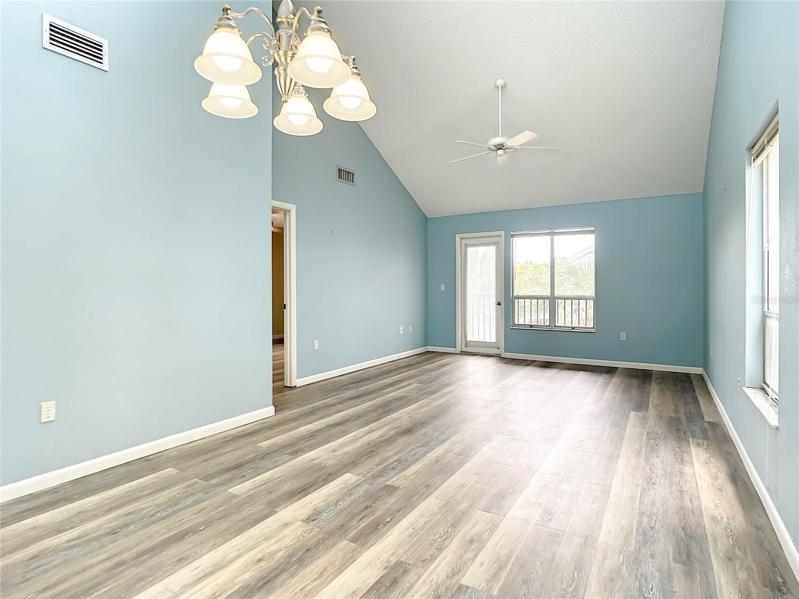 Great room has view to the pond and access to the screened in lanai