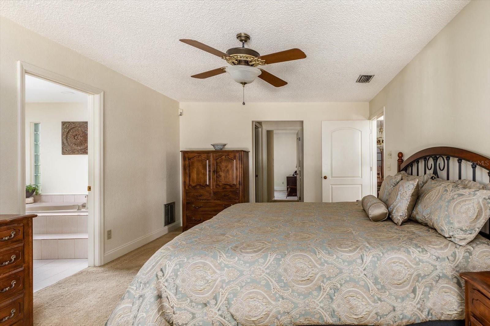 Primary Bedroom with view to en Suite Bathroom and toward Bonus Room.