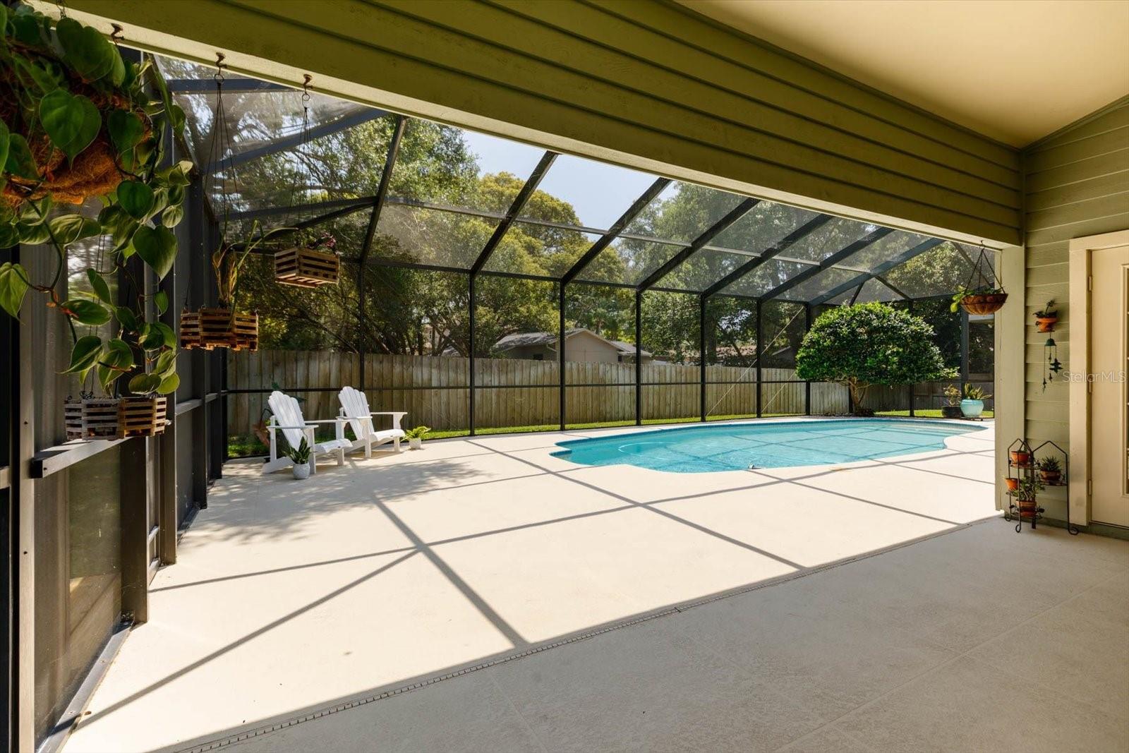 Pool deck view from large Lanai area for outdoor furnishings.