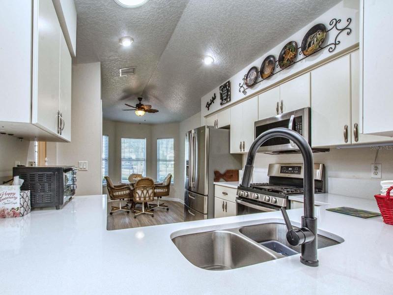 New , Stainless look in the kitchen, You can work from your kitchen and see into the livingroom.