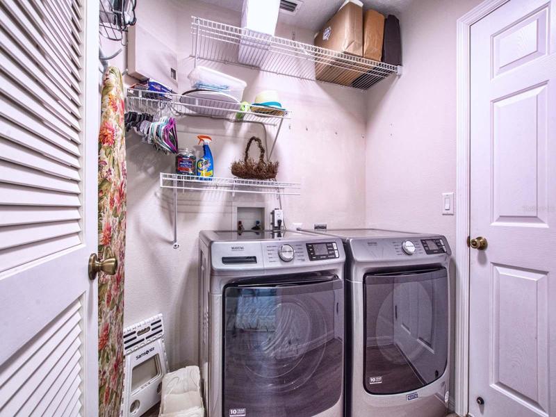New Washer and Dryer laundry room is next to garage.