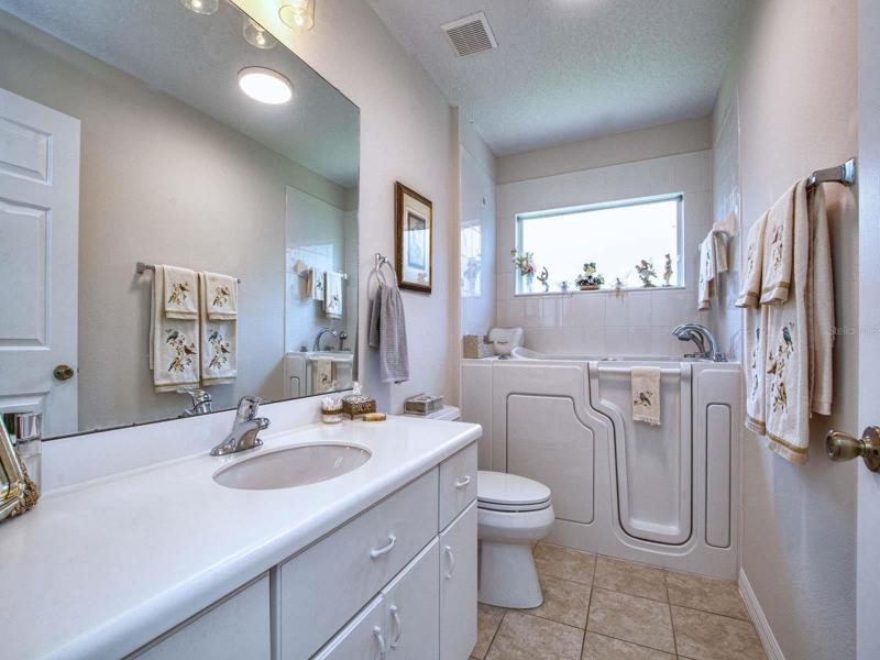 Bath 2 has a walk in bathtub.