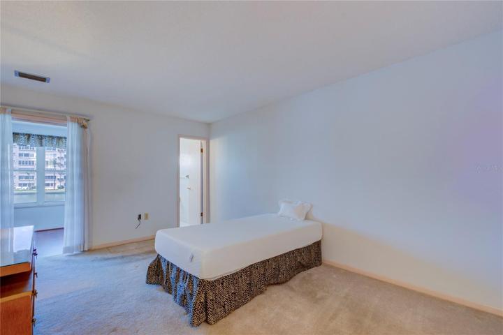 Primary Bedroom Suite w water views & walk in closet.
