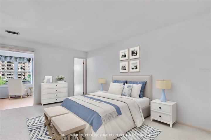virtually staged .... owners suite with water view.