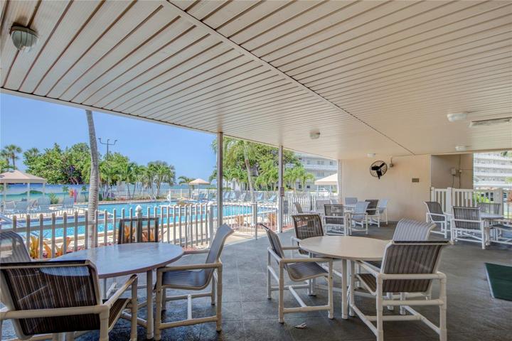 Shady pool patio at Town Shores main waterfront pool for residents to enjoy!