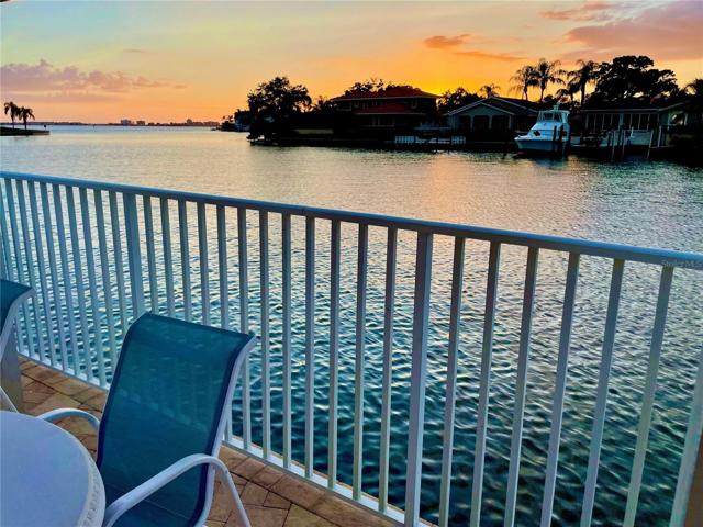 Stunning waterfront sunsets poolside at HAMPTON TOWN SHORES Gulfport: a premier active adult community on Boca Ciega Bay.