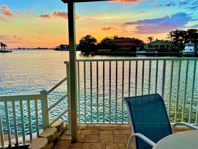 Stunning waterfront sunsets poolside at HAMPTON TOWN SHORES Gulfport: a premier active adult community on Boca Ciega Bay.