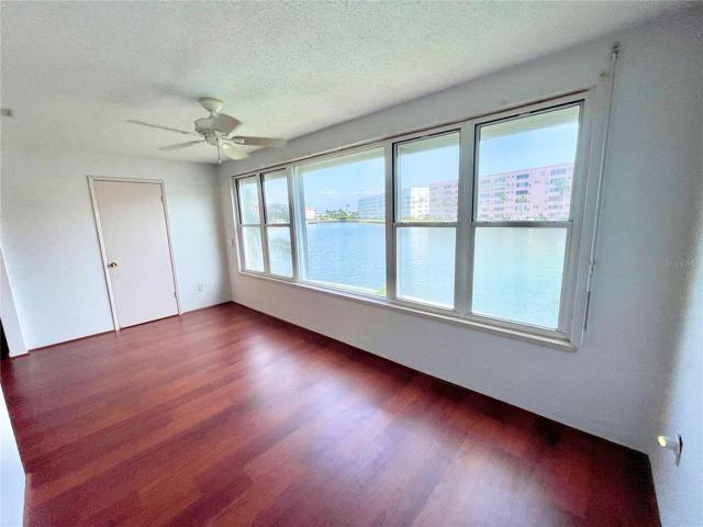 A full wall of windows with lovely water views protected by electric hurricane shutters.