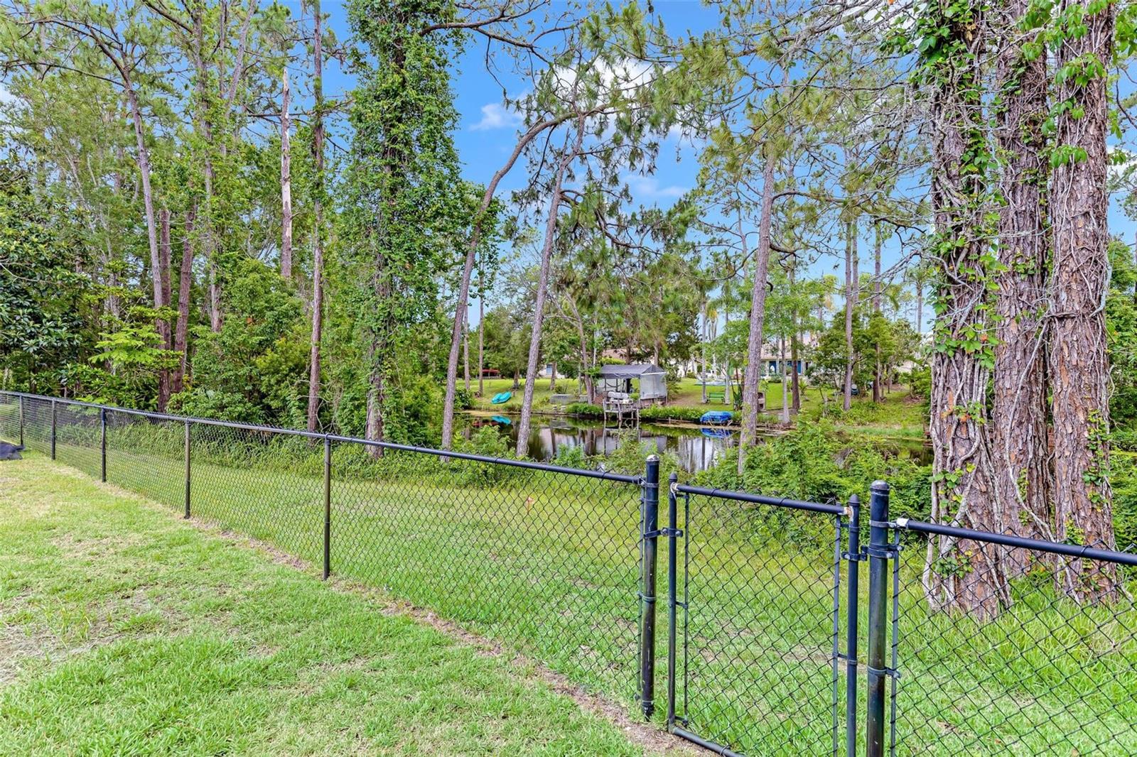 Fenced Back Yard to Canal