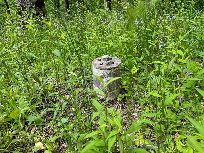 Well head located up the hill from the larger parcel