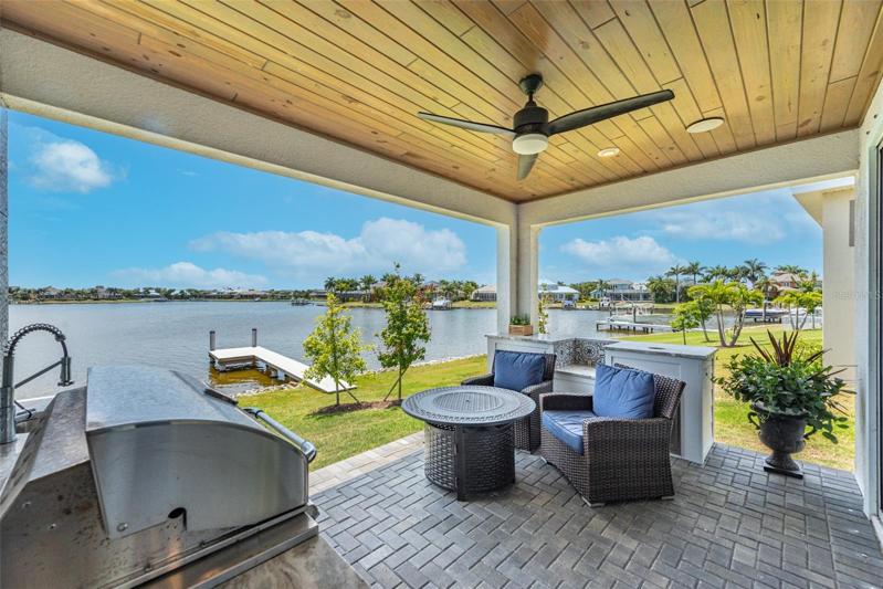 Notice the ceiling and pavers and there are extra cabinets behind the chairs.