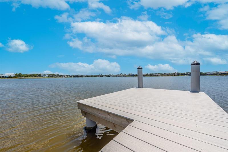Dock and water view of the lagoon. There is a lock system to lift your boat into the canal that leads out to Tampa Bay.
