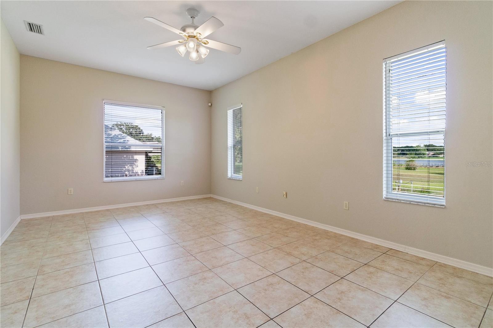 Family Room with east facing windows overlooking the lake and kitchen to the left