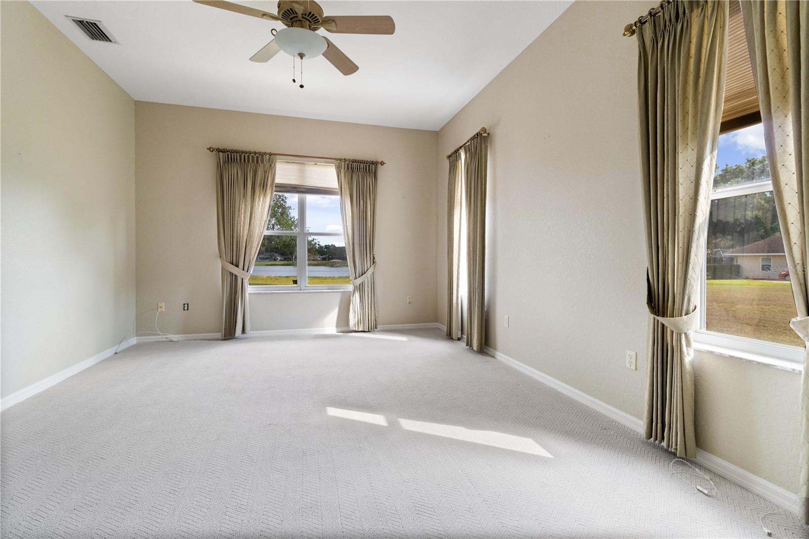 Spacious Master Bedroom with window overlooking Lake Deeson