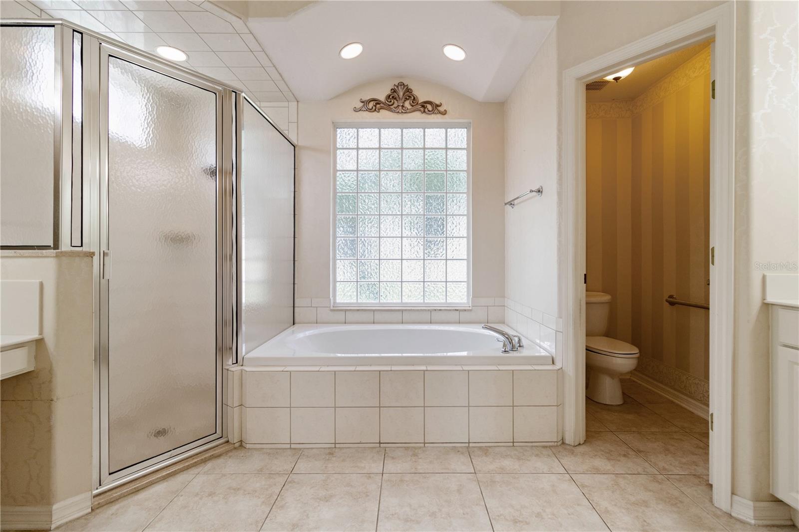 Master Bath with separate tub and shower and private Water Closet