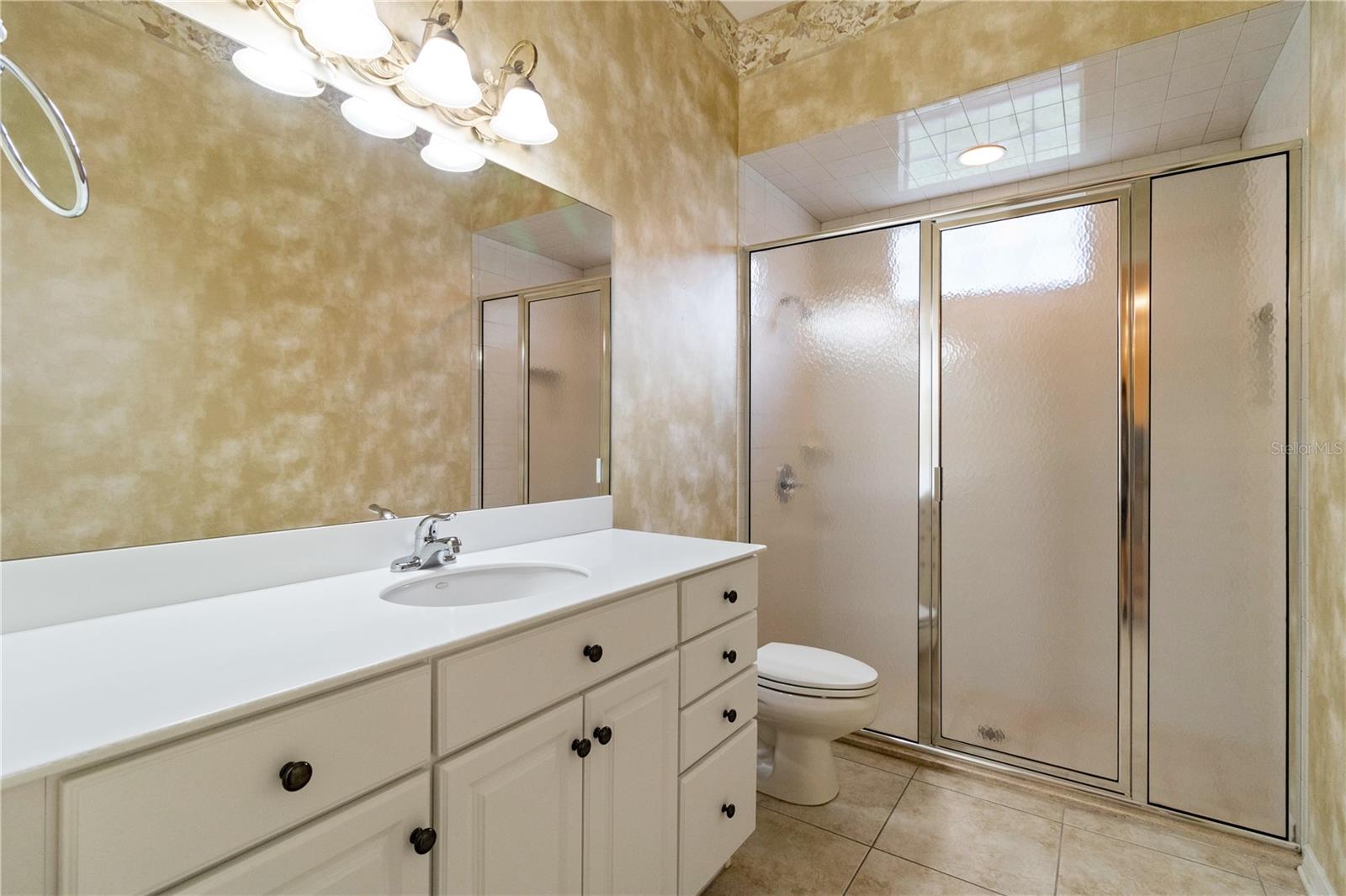 Hall Bath - located off the side hall, between Bedrooms 2 and 3 and close to the Family Room