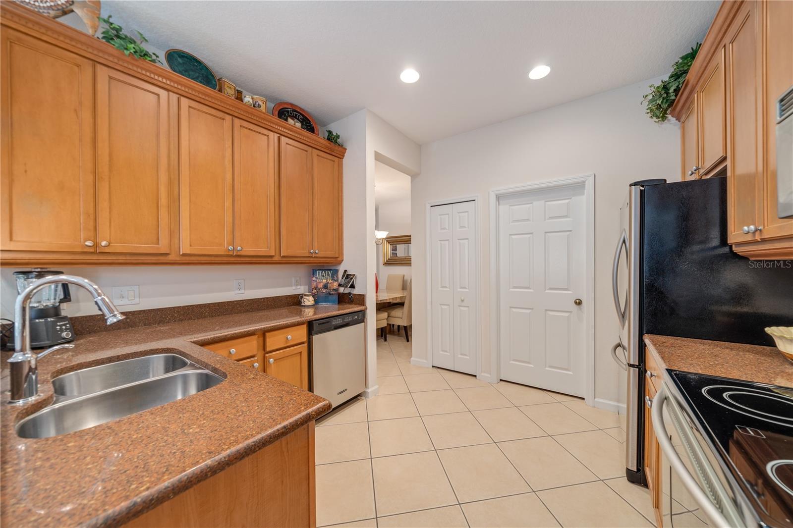Kitchen located just off Dining Room and Door leading into Laundry Room with access to Garage