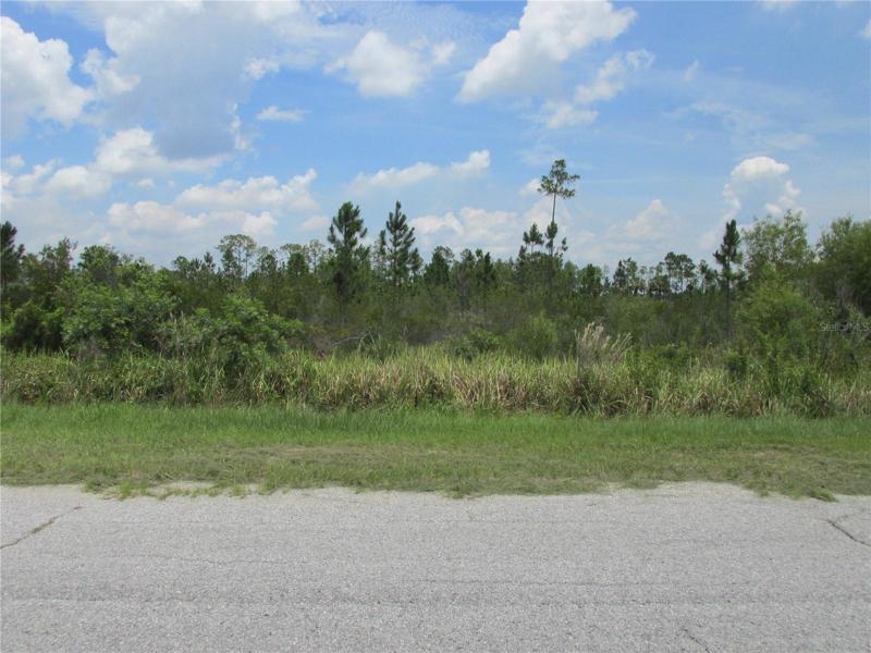 Road is paved in front of the lot.