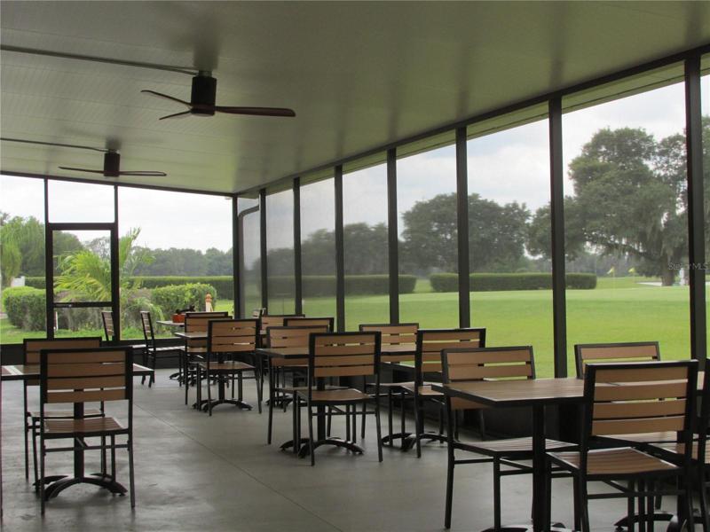 Screened outside dining room at the 19th Hole, the restaurant at the clubhouse.