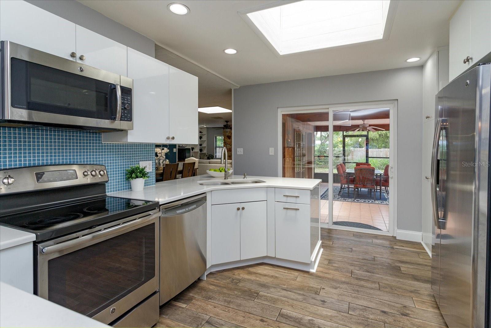 The kitchen has sliders leading out to the rear lanai.