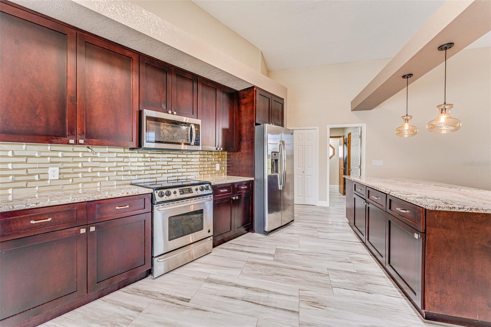 Granite counter tops with glass tile backsplash